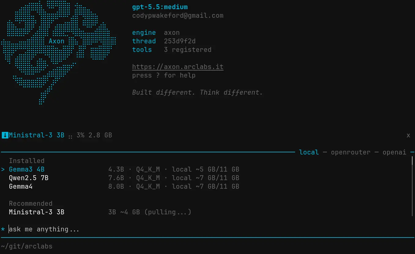 TUI model switcher on the local tab showing an Ollama model downloading